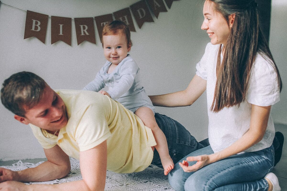 A joyful family enjoying a birthday celebration with playful moments and smiles.
